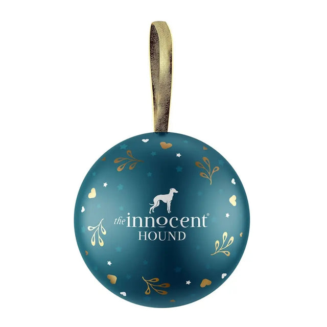 Teal spherical christmas treat bauble with gold leaf patterns and a white dog silhouette from the innocent hound christmas collection