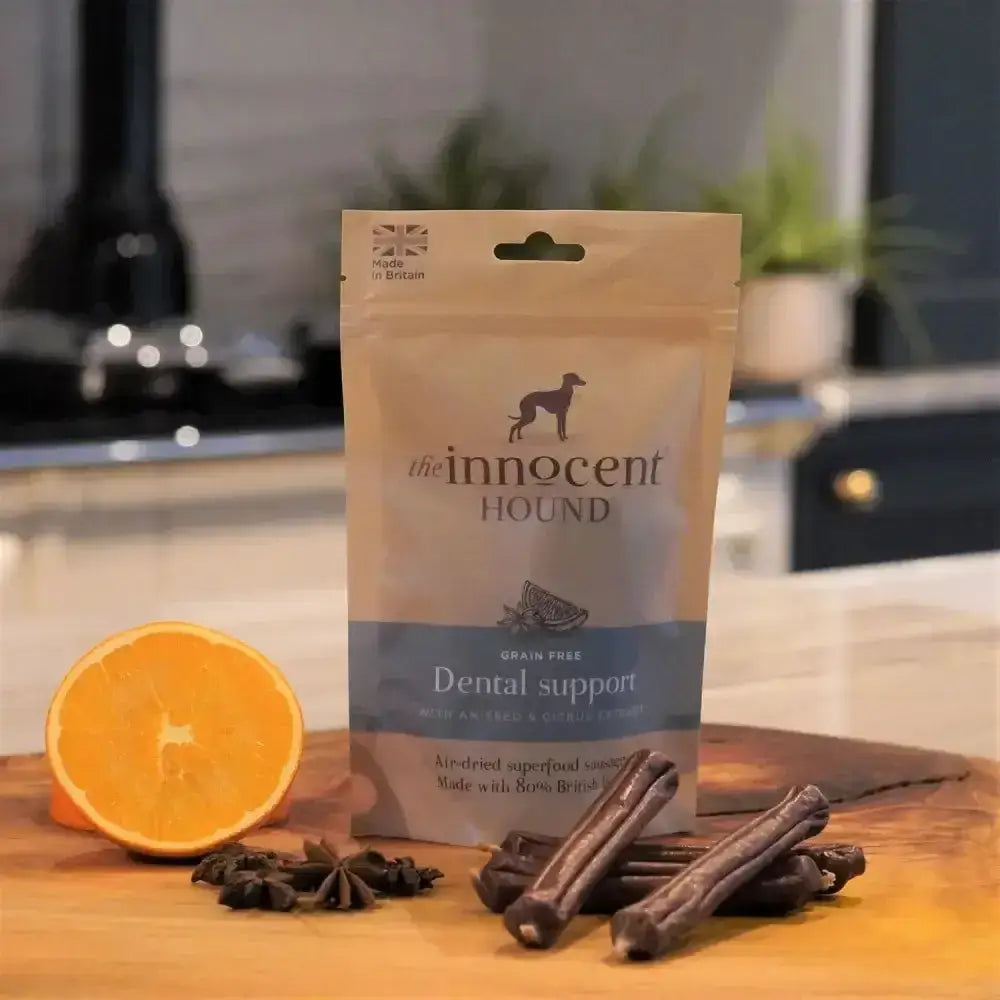 A beige pouch of the innocent hound dental support sausage treats with a blue band and silhouette logo