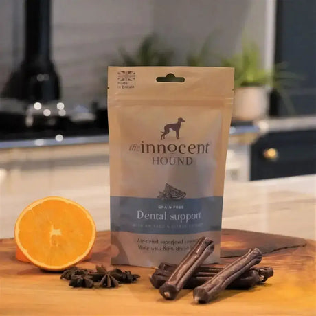 A beige pouch of the innocent hound dental support sausage treats with a blue band and silhouette logo
