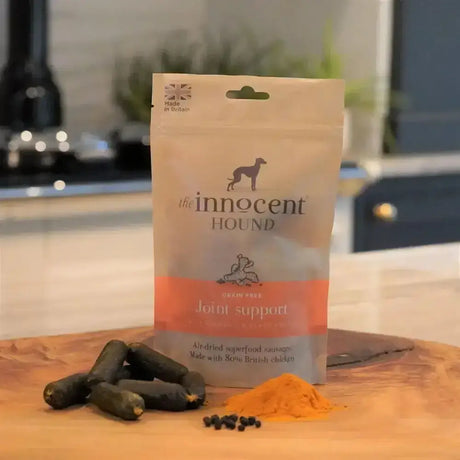 A beige and orange pouch of the innocent hound joint support sausage treats made with bone broth chicken