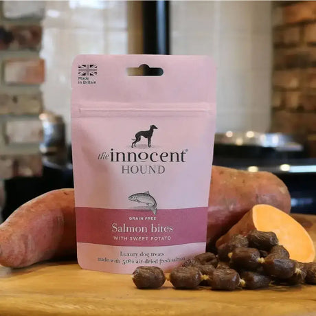 Pink pouch of innocent hound salmon bites with sweet potato treats hand-made grain-free dog snacks