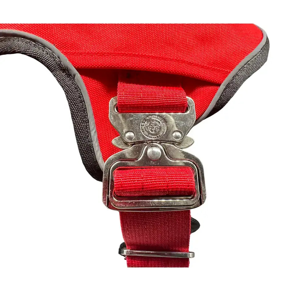 Red nylon ultimate btactical harness in citrus red with silver buckle gray trim and hidden tracker pocket