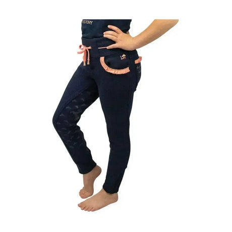 Navy stretch material princess and the pony pull on jodhpurs with peach ruffled trim and elasticated waistband by little rider