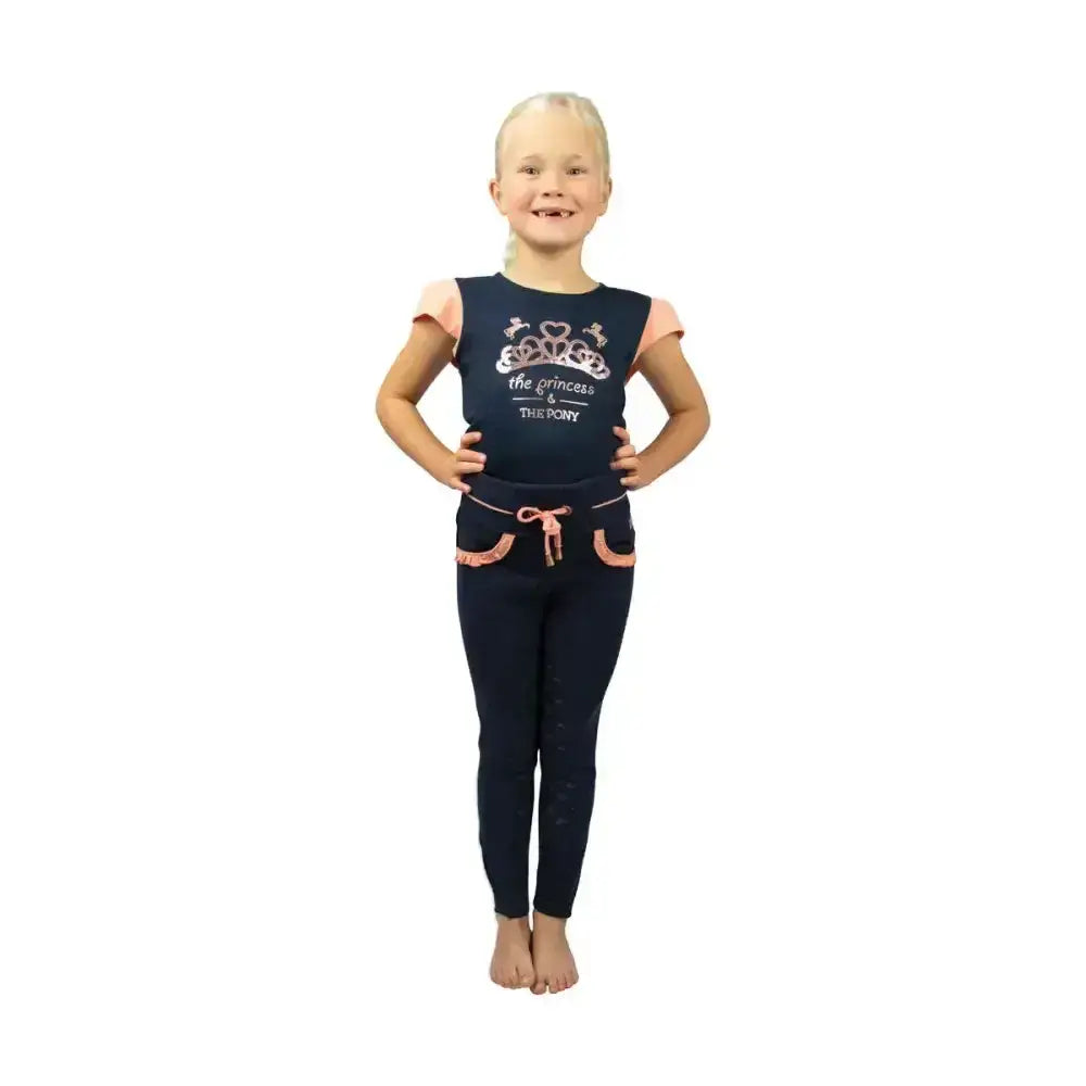 Navy t-shirt features a peach princess-themed pajama set with a crown graphic perfect for pony loving princess fans