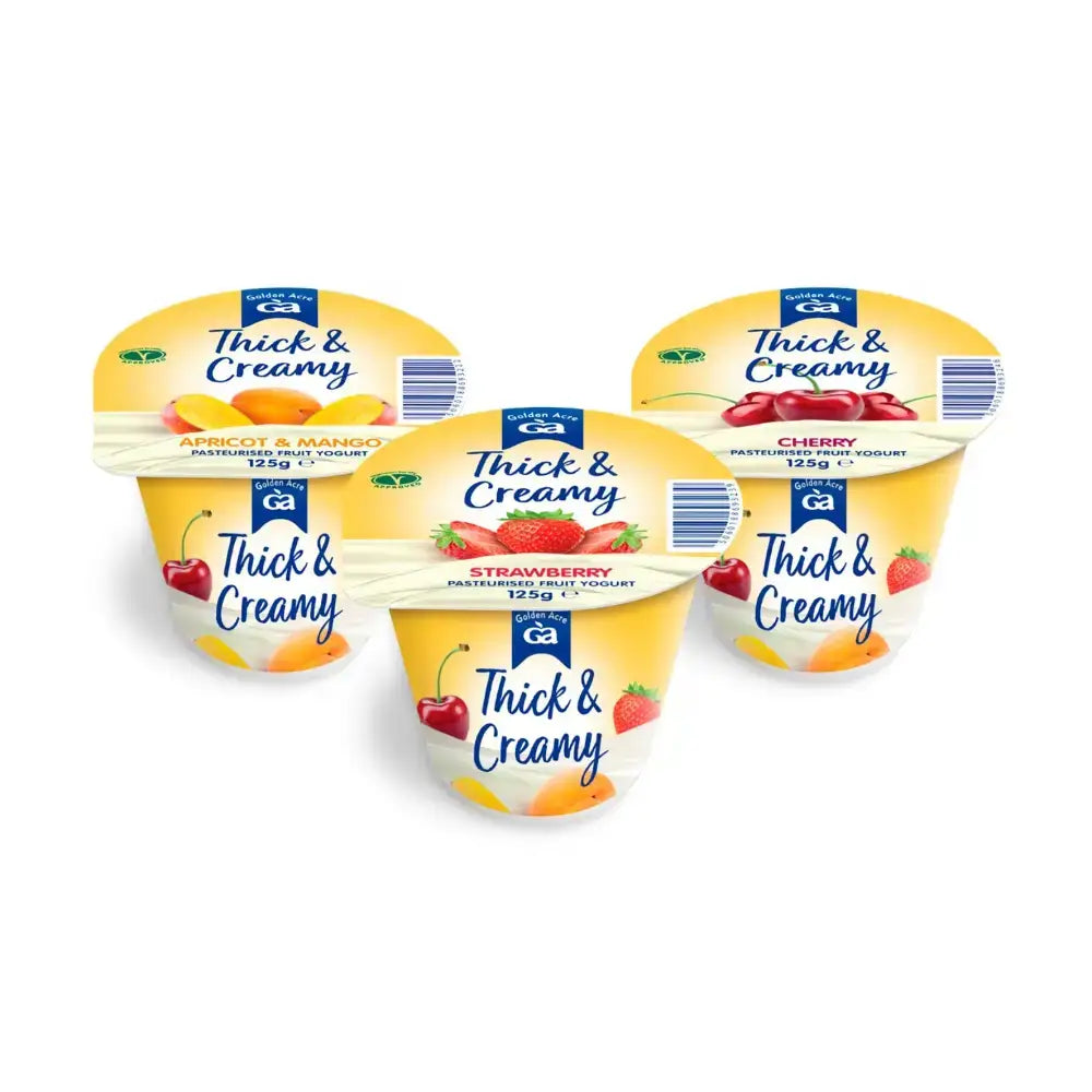 Four creamy yoghurt golden yellow cups of thick & creamy yoghurt in apricot mango strawberry and cherry flavors