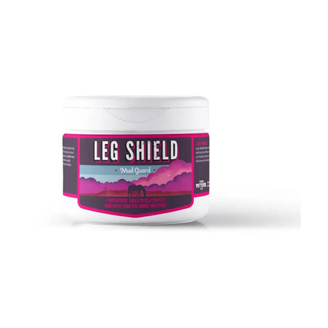 White plastic jar of thomas pettifer leg shield with pink and black label for muddy conditions against purple mountains
