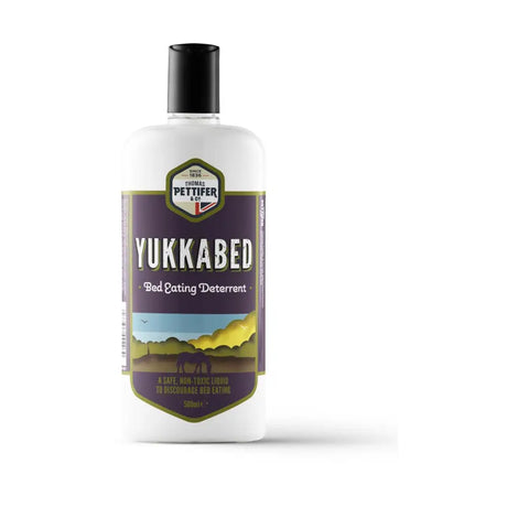 White plastic bottle with black cap and purple label of thomas pettifer yukka bed eating deterrent that discourages horses