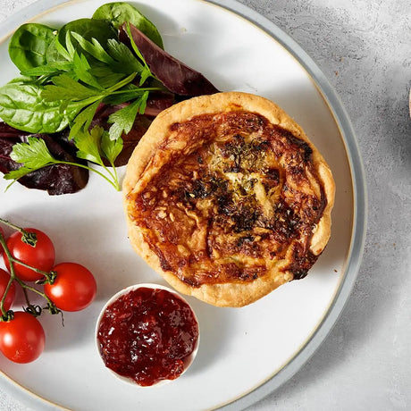 Golden-brown thorners smoked bacon and leek quiche crafted with handmade shortcrust pastry and savory herbs