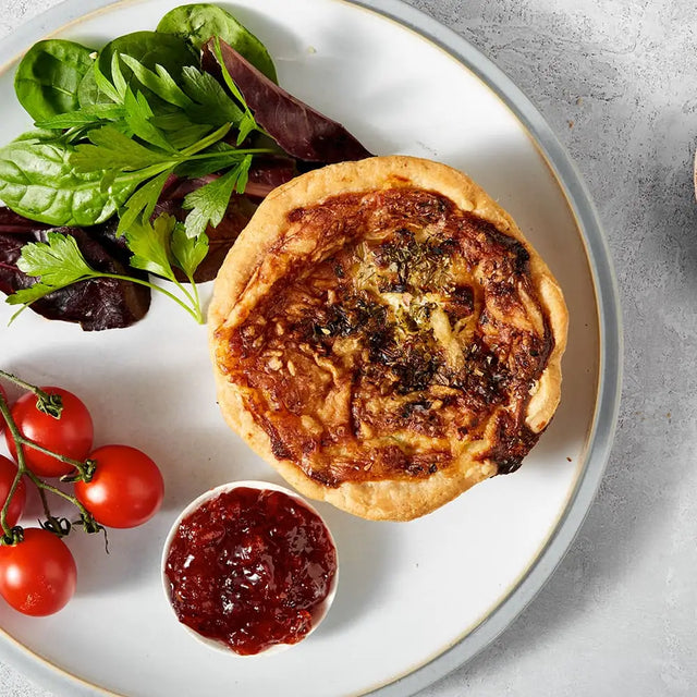 Golden-brown thorners smoked bacon and leek quiche crafted with handmade shortcrust pastry and savory herbs