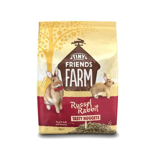 A 2kg yellow and red bag of tiny friends farm russels tasty nug featuring rabbits and the brand logo