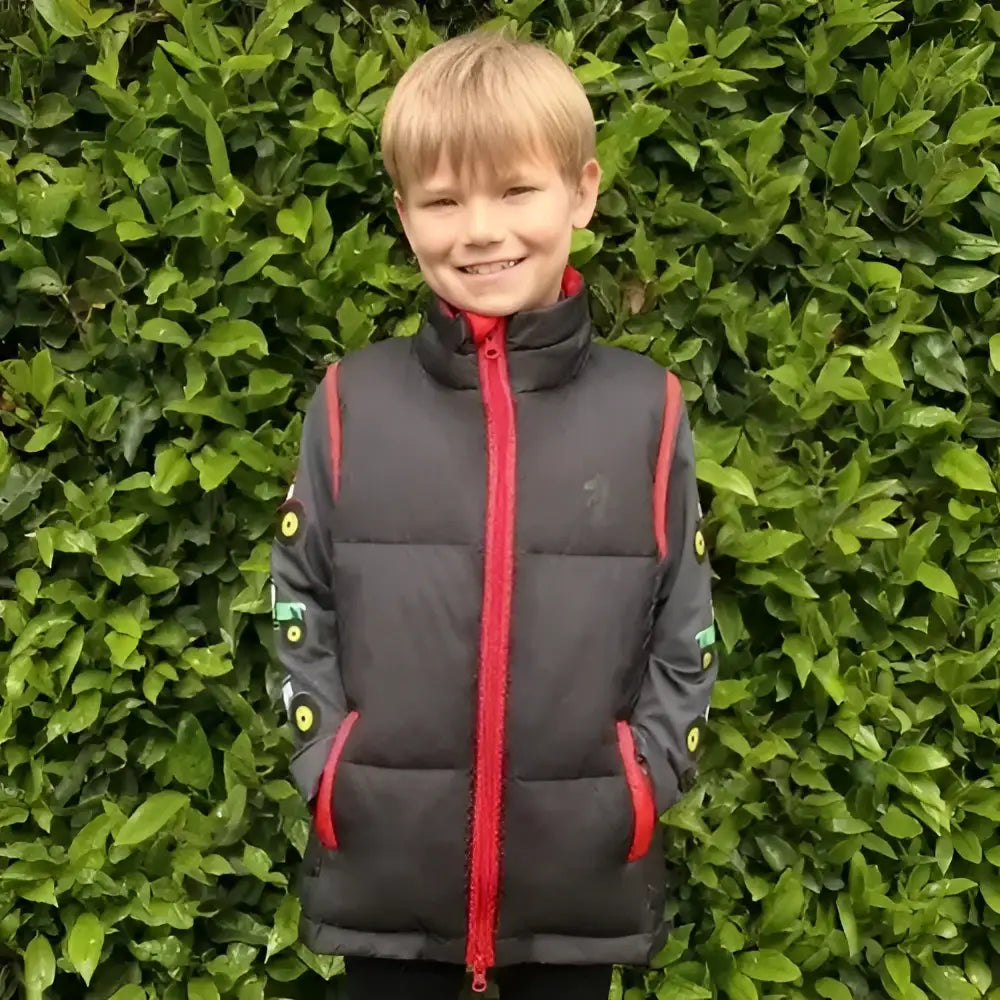Black lightweight padded gilet with red zipper and green sleeve patches from little knights tractor collection
