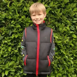 Black lightweight padded gilet with red zipper and green sleeve patches from little knights tractor collection