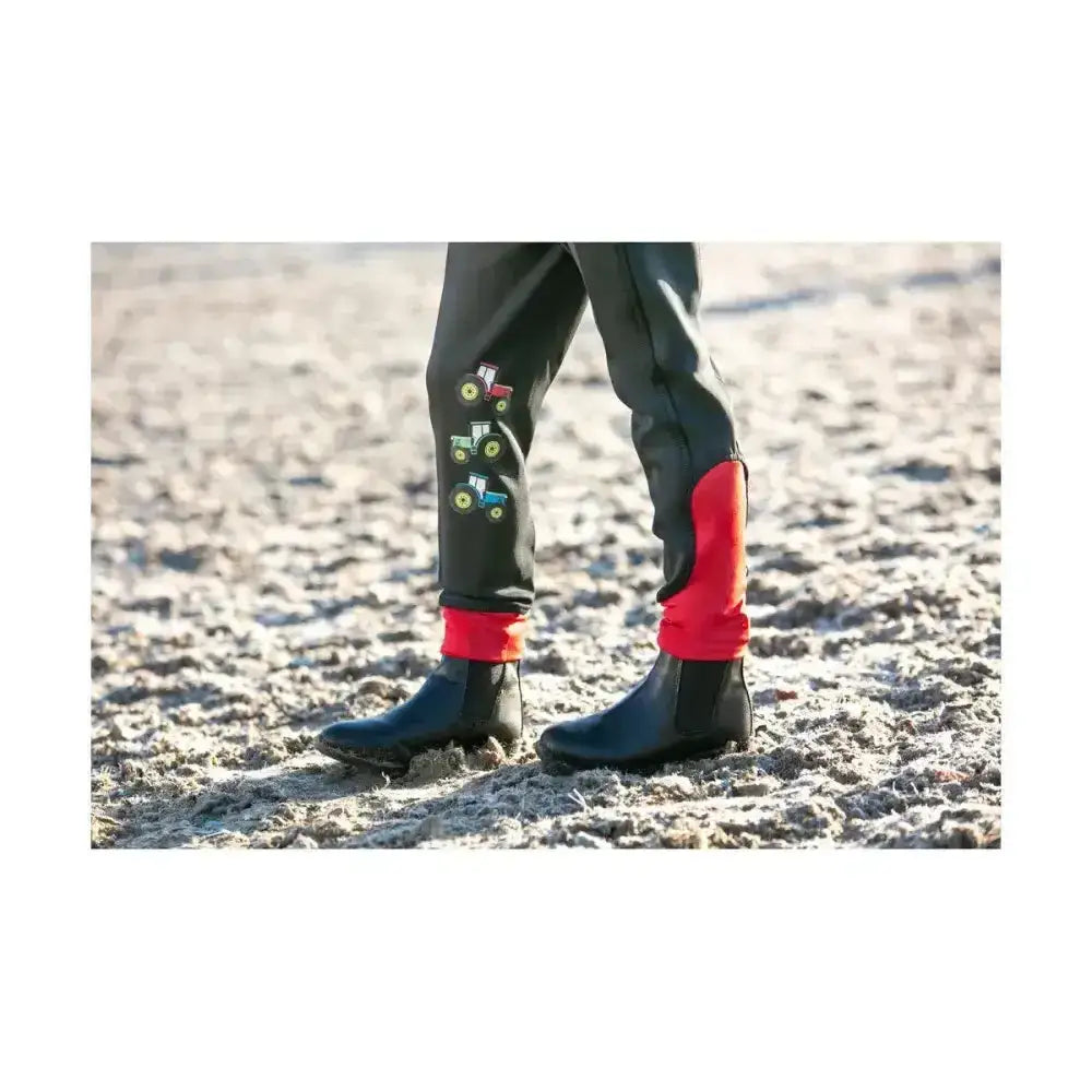 Black and red waterproof tractor collection riding tights by Little Knight with embroidered tractor designs on the leg