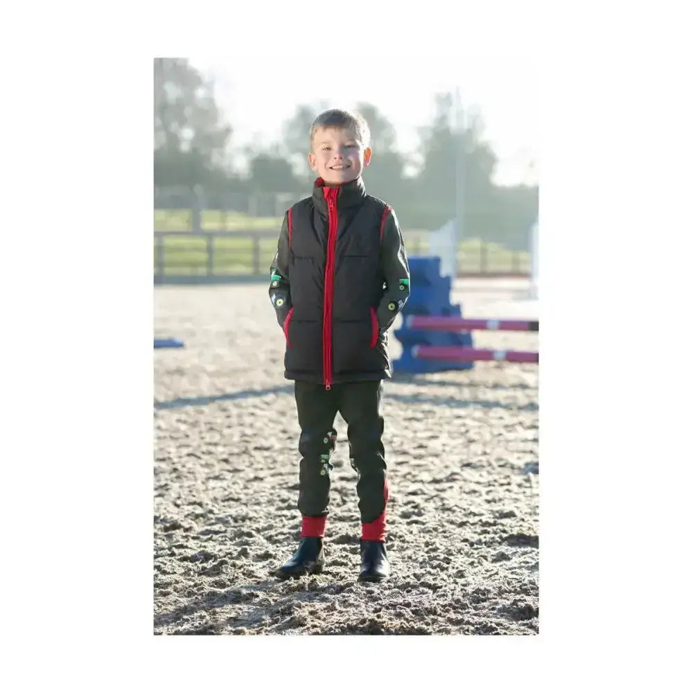 Black and red insulated vest with reflective green accents on sleeves from little knight tractor collection riding tights
