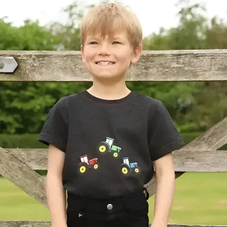Black tractor collection t-shirt by little knight with colorful red green and blue tractor graphic on front
