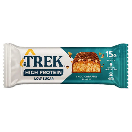 A trek high protein bar in teal and white wrapper with high protein chocolate caramel flavor and visible nuts on top