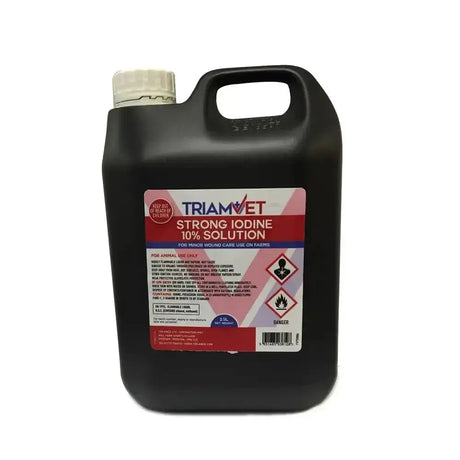Black plastic jug with white cap and colorful label for triamvet strong iodine 10% solution used on newborn lambs external areas