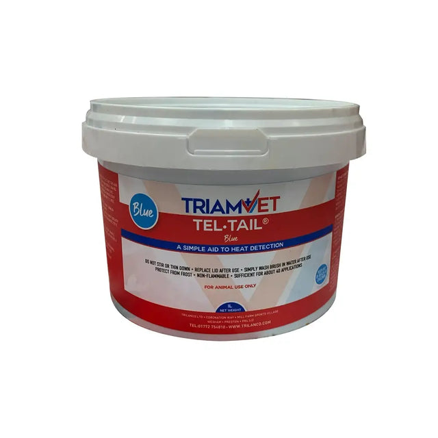 Red and white labeled plastic bucket of triamvet tel-tail paint used as a veterinary heat detection aid for mounting activities