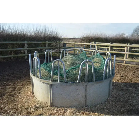 Metallic gray circular feeding ring topper with super strong green trickle net and curved metal bars for easy hay feeding