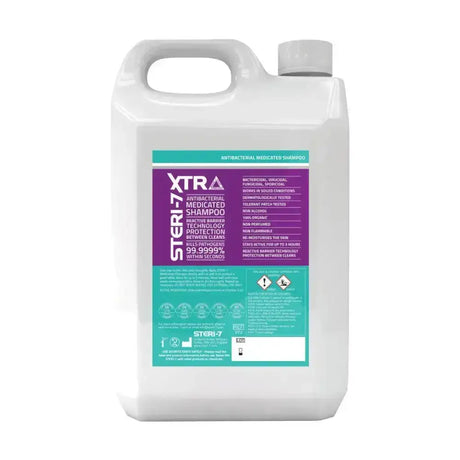 White plastic jug with gray cap and purple teal label of trm steri 7 extra antibacterial medicated shampoo