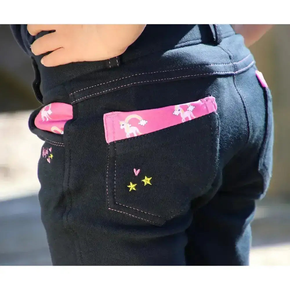 Black denim unicorn magic breeches with pink unicorn pocket flap and yellow star embroidery from little rider