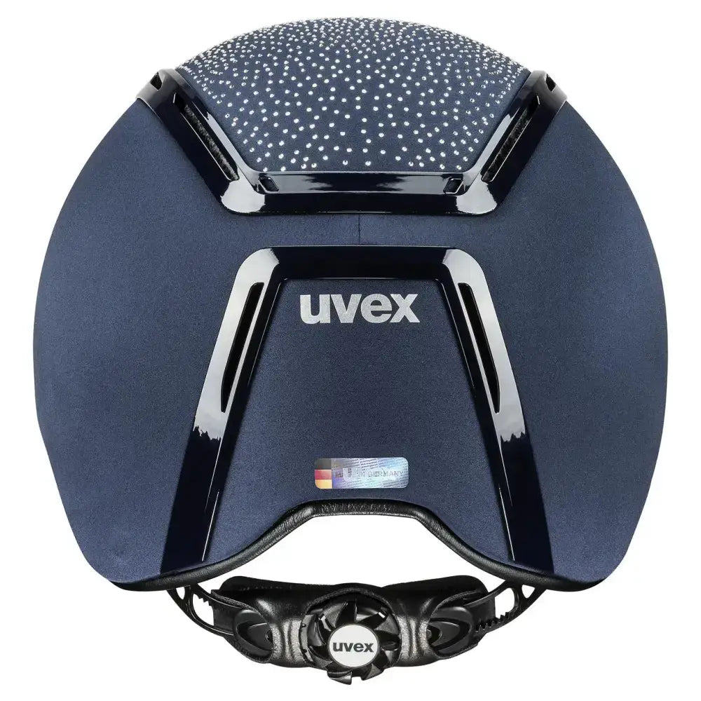 Dark blue uvex exxeed flash riding helmet with textured dotted top glossy black accents and vegan leather details