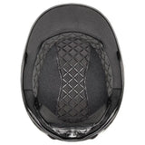 Black uvex exxeed pro riding hat with quilted padding, mesh lining, vegan leather straps, and chrome frame details