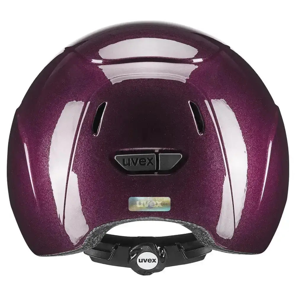A glossy purple uvex kiddox shiny riding helmet with sleek aerodynamic design and black vents for kids biking
