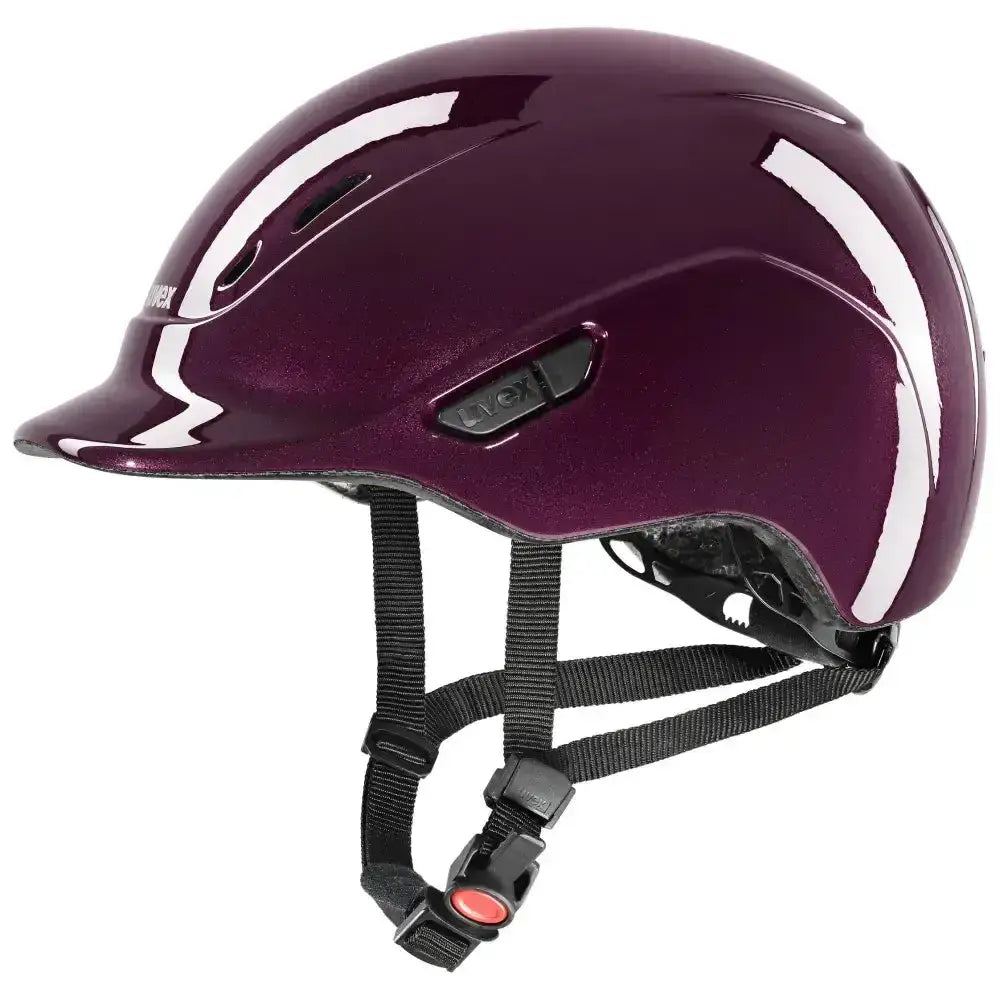 A glossy deep purple uvex kiddox shiny riding helmet with white accent stripes and black adjustable straps for kids