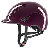 A glossy deep purple uvex kiddox shiny riding helmet with white accent stripes and black adjustable straps for kids