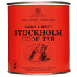Red cylindrical can of carr and day and martin prest stockholm tar hoof with natural vegetable tar and horse hoof design