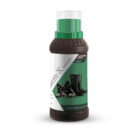 Brown plastic bottle with green cap labeled verm-x original liquid for dogs with natural active ingredients for intestinal hygiene