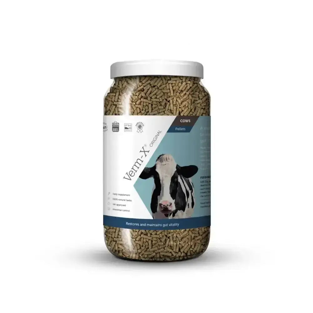 A clear jar of brown verm-x original pellets for cows controls intestinal hygiene as a cattle supplement