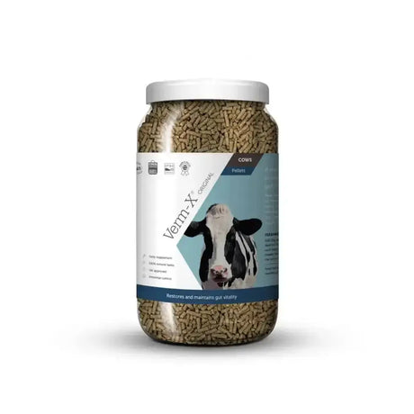 A clear jar of brown verm-x original pellets for cows controls intestinal hygiene as a cattle supplement