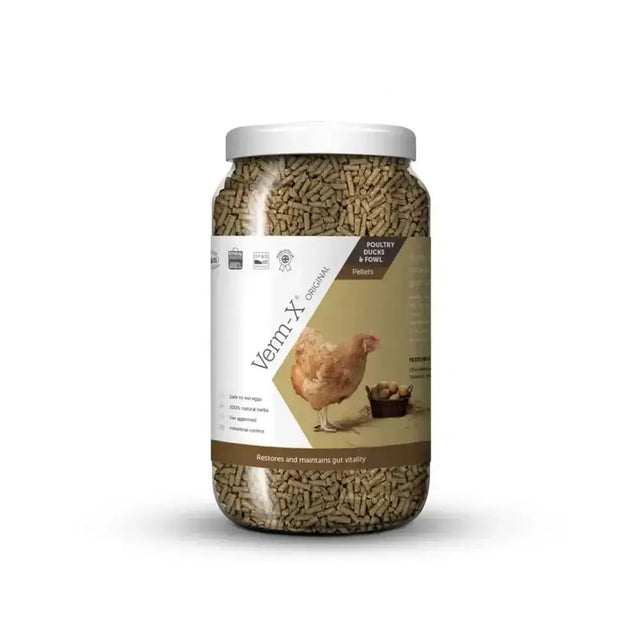 A clear plastic jar with a white lid containing brown verm-x original pellets for poultry with natural active ingredients