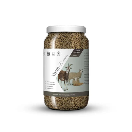 A clear plastic jar with white lid filled with brown verm-x original pellets for sheep and goats controls intestinal hygiene