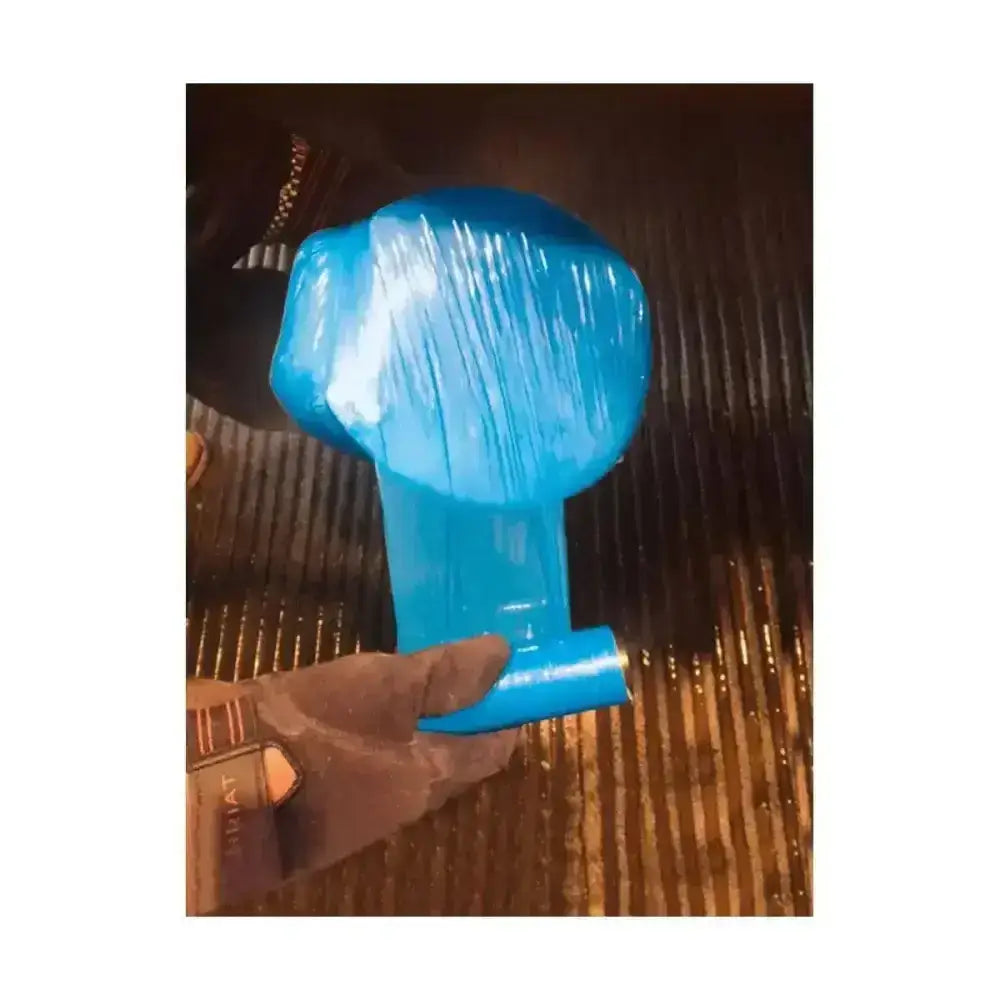 A bright blue glossy plastic vet cling film balloon with a long stem held by a gloved hand for securing ice packs