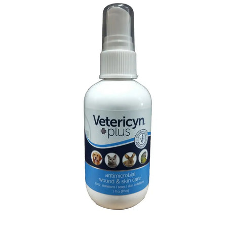 White plastic spray bottle with clear nozzle and blue vetericyn plus liquid label featuring pet images and white cap
