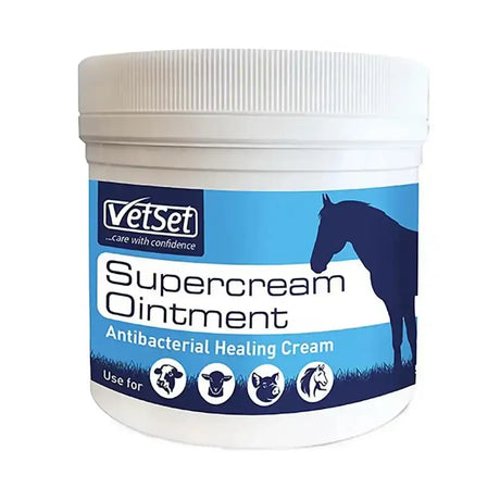 White plastic jar of vetset supercream ointment antibacterial healing cream with blue label and horse silhouettes