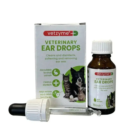 Brown glass bottle with white cap and dropper of vetzyme antibacterial ear drops to remove wax for cats dogs small animals