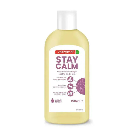 A clear plastic bottle with white cap contains pale yellow vetzyme stay calm oil for dogs and puppies with ginger oils