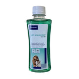 Green liquid pet dental rinse in clear plastic bottle with white cap and virbac vet aquadent label for anti-plaque care