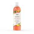 A transparent bottle of wahl dirty beastie shampoo with vibrant orange liquid and a perfectly balanced formula