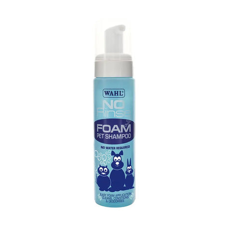 Light blue cylindrical bottle of wahl no rinse shampoo for dogs with white pump and cartoon animal for lustrous coat