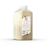 A translucent beige plastic bottle of wahl oatmeal shampoo with white cap for horse grooming and horse shampoos
