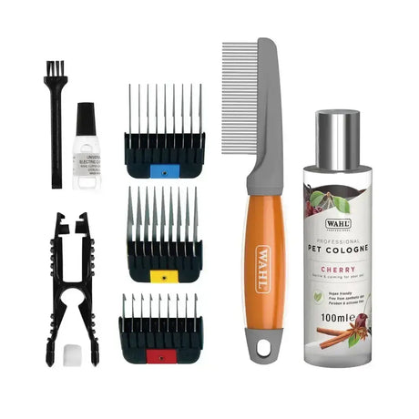 Orange-handled wahl ss-pro pet clipper with gray accents and a detachable comb in the clipper vanity kit