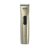A sleek metallic gold wahl super trim pet cordless trimmer with a black power button and silver cutting blade