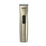 A sleek metallic gold wahl super trim pet cordless trimmer with black control panel and silver blades for grooming pets