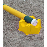 Yellow plastic sand mold with a green and white cylinder inside for waldhausen jump block training fun