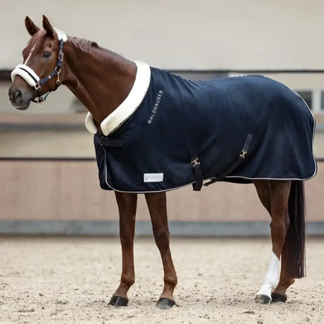 Navy blue waldhausen modern rose horse blanket with white fleece lining black straps and rose gold fur collar details